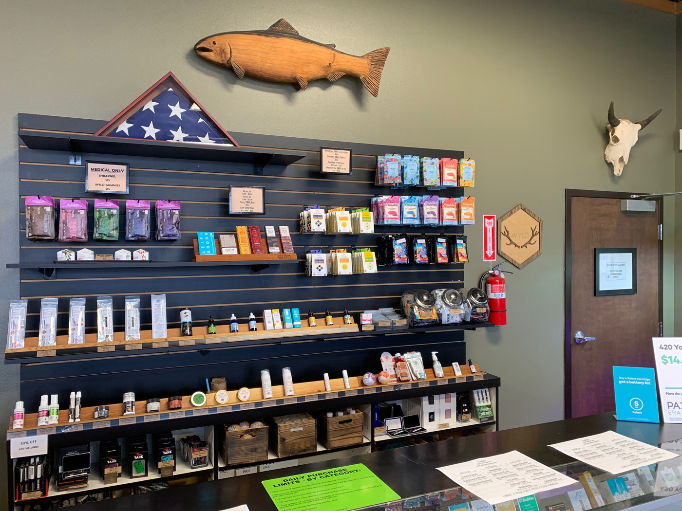 The main lounge of Cougar Cannabis displaying common CBD oil products in Roseburg, OR